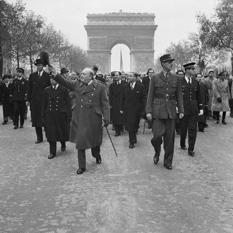 Winston Churchill and General Charles de Gaulle walk down the Avenue des Champs Elysee duirng the French Armistice Day parade in Paris 11 November 1944. BU1292